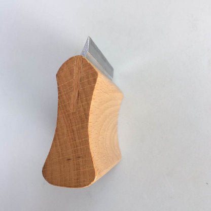 Close-up of a sturdy beech wood handle of a pet hair remover for horses, designed for comfortable grooming.